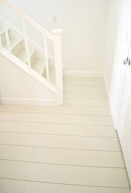 Painted plank plywood floor in cream