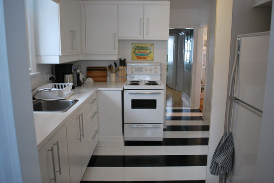 Black and white striped kitchen floor with peel and stick tiles