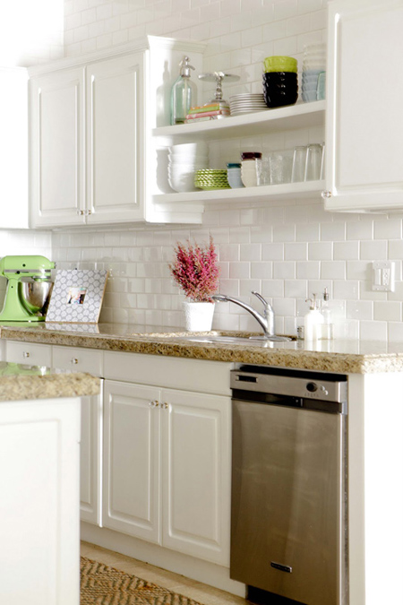 White kitchen with gold granite countertops courtesy of Made By Girl
