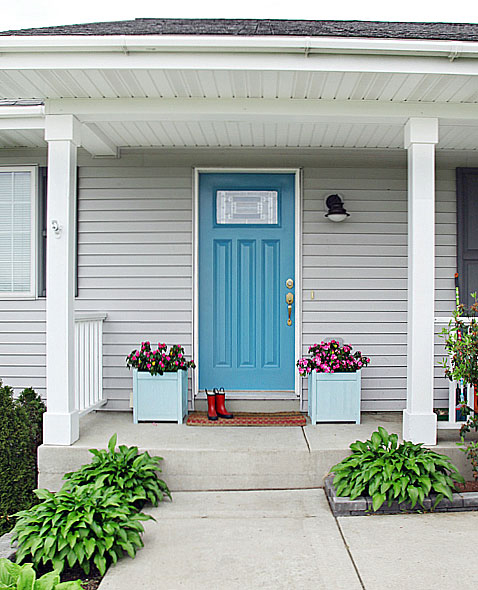 Behr Harbor teal front door with gray siding