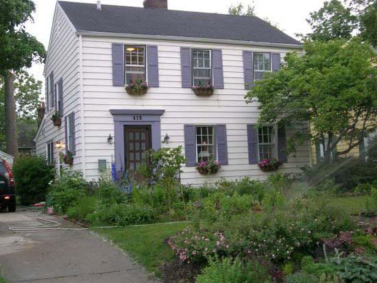 Mauve exterior siding with lavender purple shutters and trim