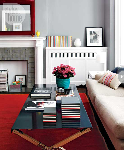 Gray white red teal living room with fireplace Style at Home