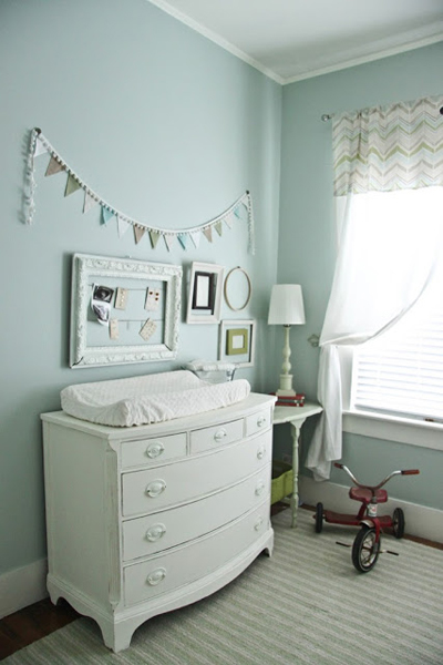 Pretty teal beige gray and green gender neutral nursery with bunting